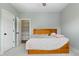 Bright bedroom featuring carpeted floors, ceiling fan, and an open closet for convenient storage at 5820 Brayton Park Pl, Holly Springs, NC 27540