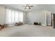 Expansive bonus room featuring neutral paint, a ceiling fan, and ample natural light at 5820 Brayton Park Pl, Holly Springs, NC 27540