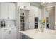 This kitchen has ample storage, featuring sleek cabinets, a pantry, and modern appliances at 5820 Brayton Park Pl, Holly Springs, NC 27540