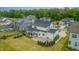 Aerial view of a home with a screened porch, patio, and landscaped backyard at 5820 Brayton Park Pl, Holly Springs, NC 27540