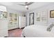 Bright bedroom featuring a bed and shuttered windows providing ample natural light at 5920 North Hills Dr, Raleigh, NC 27609