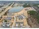 Community aerial view showcases homes near a tranquil lake and wooded areas at 63 Radcliffe Ct, Clayton, NC 27527
