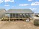 Expansive backyard featuring a screened porch and deck, perfect for outdoor gatherings and leisure at 63 Radcliffe Ct, Clayton, NC 27527
