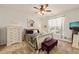 Cozy bedroom features a plush bed, soft lighting, and a tranquil window view at 63 Radcliffe Ct, Clayton, NC 27527