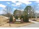 Lakeside at Flowers Plantation community entrance sign with landscaped grounds and tree-lined sidewalk at 63 Radcliffe Ct, Clayton, NC 27527
