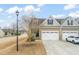 Charming home featuring a welcoming entrance, a two-car garage, and landscaped front yard at 63 Radcliffe Ct, Clayton, NC 27527