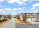 A well-maintained home with a two-car garage and a manicured lawn is captured in this exterior shot at 63 Radcliffe Ct, Clayton, NC 27527