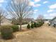 An exterior view showcases the home's setting with landscaping along the street and neighboring houses visible at 63 Radcliffe Ct, Clayton, NC 27527