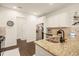 Eat-in kitchen with stainless appliances, granite countertops, and a bright, inviting atmosphere at 63 Radcliffe Ct, Clayton, NC 27527