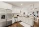 Bright kitchen features stainless steel appliances, granite countertops, and seamless flow to the living space at 63 Radcliffe Ct, Clayton, NC 27527