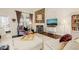 Cozy living room featuring a stone fireplace, hardwood floors and natural lighting at 63 Radcliffe Ct, Clayton, NC 27527