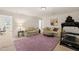 Bright living room features two sofas, a plush rug, and exercise equipment for convenience at 63 Radcliffe Ct, Clayton, NC 27527