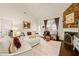 Well-lit living room featuring hardwood floors, a fireplace and modern furnishings at 63 Radcliffe Ct, Clayton, NC 27527