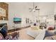 Bright living room featuring hardwood floors, a stone fireplace and modern furnishings at 63 Radcliffe Ct, Clayton, NC 27527