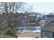 Picturesque view of the community pond highlighting the surrounding houses at 63 Radcliffe Ct, Clayton, NC 27527