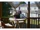 Charming porch with round table, seating, decorative details, and serene neighborhood views at 63 Radcliffe Ct, Clayton, NC 27527