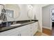 Bathroom featuring double vanity with granite countertop and dual mirrors at 65 Gentle Winds Dr, Chapel Hill, NC 27517