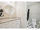 Bathroom with a granite vanity and a shower-tub combo with black curtain and tiled floor at 65 Gentle Winds Dr, Chapel Hill, NC 27517