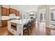 Spacious kitchen featuring a large center island, barstool seating, and stainless appliances at 65 Gentle Winds Dr, Chapel Hill, NC 27517