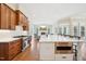 Modern kitchen with custom cabinets, stainless appliances, and a large center island at 65 Gentle Winds Dr, Chapel Hill, NC 27517