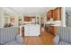 Gourmet kitchen featuring a large island, custom cabinets, and an open design concept at 65 Gentle Winds Dr, Chapel Hill, NC 27517