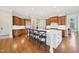 Open kitchen with an island, wooden cabinets, and stainless steel appliances at 65 Gentle Winds Dr, Chapel Hill, NC 27517