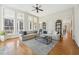 Spacious living room featuring hardwood floors, neutral tones, and lots of natural light at 65 Gentle Winds Dr, Chapel Hill, NC 27517