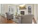 Cozy sunroom with a fireplace and access to a patio or deck at 65 Gentle Winds Dr, Chapel Hill, NC 27517