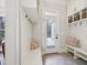 Mudroom with built-in bench, shelving, and storage creating a functional and organized entryway at 65 Gentle Winds Dr, Chapel Hill, NC 27517
