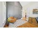Stylish home office featuring custom wall trim, wood floors, and French doors at 65 Gentle Winds Dr, Chapel Hill, NC 27517
