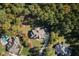 Expansive aerial view of the home showcasing the well-manicured lawn, trees, and surrounding neighborhood at 7004 Bartons Bend Way, Raleigh, NC 27614