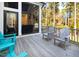Relaxing backyard deck with Adirondack chairs overlooking wooded views at 7004 Bartons Bend Way, Raleigh, NC 27614