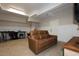 Finished basement with comfortable seating and space for a workshop at 7004 Bartons Bend Way, Raleigh, NC 27614