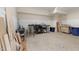 A view of the basement with wainscoting, speckled flooring, and workshop area with tools at 7004 Bartons Bend Way, Raleigh, NC 27614