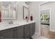 The bathroom offers double sinks, modern finishes and natural light at 7004 Bartons Bend Way, Raleigh, NC 27614