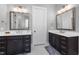 Modern bathroom with dual vanities, granite countertops, and a walk-in shower at 7004 Bartons Bend Way, Raleigh, NC 27614