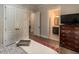 This bedroom features hardwood floors, closet doors and en-suite bath at 7004 Bartons Bend Way, Raleigh, NC 27614
