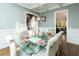 Elegant dining room with modern chandelier and seating for eight at 7004 Bartons Bend Way, Raleigh, NC 27614
