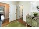 The hallway features hardwood floors, stylish décor and an open view at 7004 Bartons Bend Way, Raleigh, NC 27614