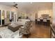 Open living space with hardwood floors, comfortable seating, and access to an outdoor patio at 7004 Bartons Bend Way, Raleigh, NC 27614
