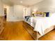 Comfortable main bedroom with hardwood floors, neutral tones, and ample natural light at 7004 Bartons Bend Way, Raleigh, NC 27614