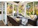 Serene screened-in porch with nature views, offering relaxation at 7004 Bartons Bend Way, Raleigh, NC 27614