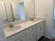 Bathroom featuring double sinks, quartz countertops, and modern fixtures, offering a clean and stylish design at 71 Furley St, Homesite 116, Sanford, NC 27330