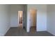 Bedroom showcasing an open closet and an additional bedroom entry, enhancing space and access at 71 Furley St, Homesite 116, Sanford, NC 27330