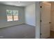 Spacious bedroom with large window for natural light and adjacent walk-in closet for ample storage space at 71 Furley St, Homesite 116, Sanford, NC 27330