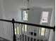 Bright living room with shiplap accent wall, ceiling fan, and abundant natural light from large windows at 71 Furley St, Homesite 116, Sanford, NC 27330