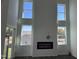 Bright living room featuring a modern fireplace, high ceilings, and multiple windows that provide ample natural light at 71 Furley St, Homesite 116, Sanford, NC 27330