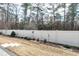 Landscaped backyard with a birdbath, mature trees, and a wood fence that provides backyard privacy at 80 Thornwhistle Pl, Garner, NC 27529