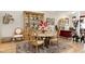 Elegant dining room with hardwood floors, decorative rug, and a stylish table setting at 80 Thornwhistle Pl, Garner, NC 27529