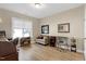 Home office features hardwood floors, neutral decor, and large window for natural light at 80 Thornwhistle Pl, Garner, NC 27529